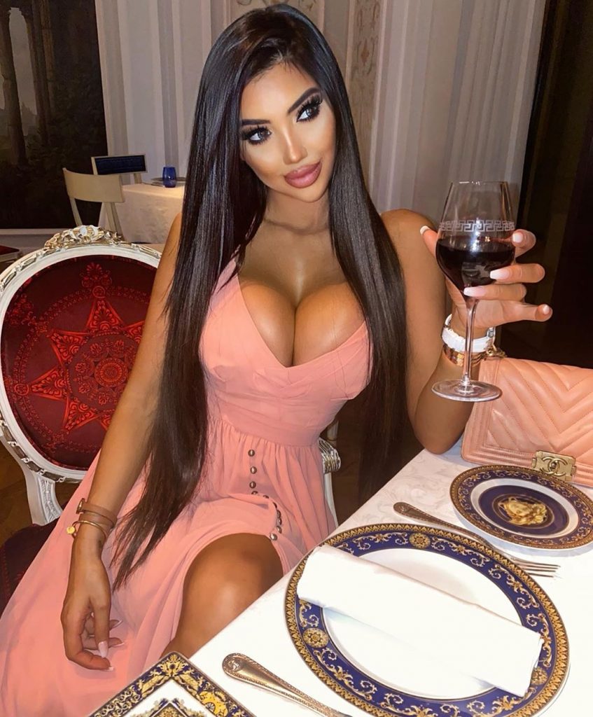 British celebrity Chloe Khan shows cleavage in hot dress at dinner